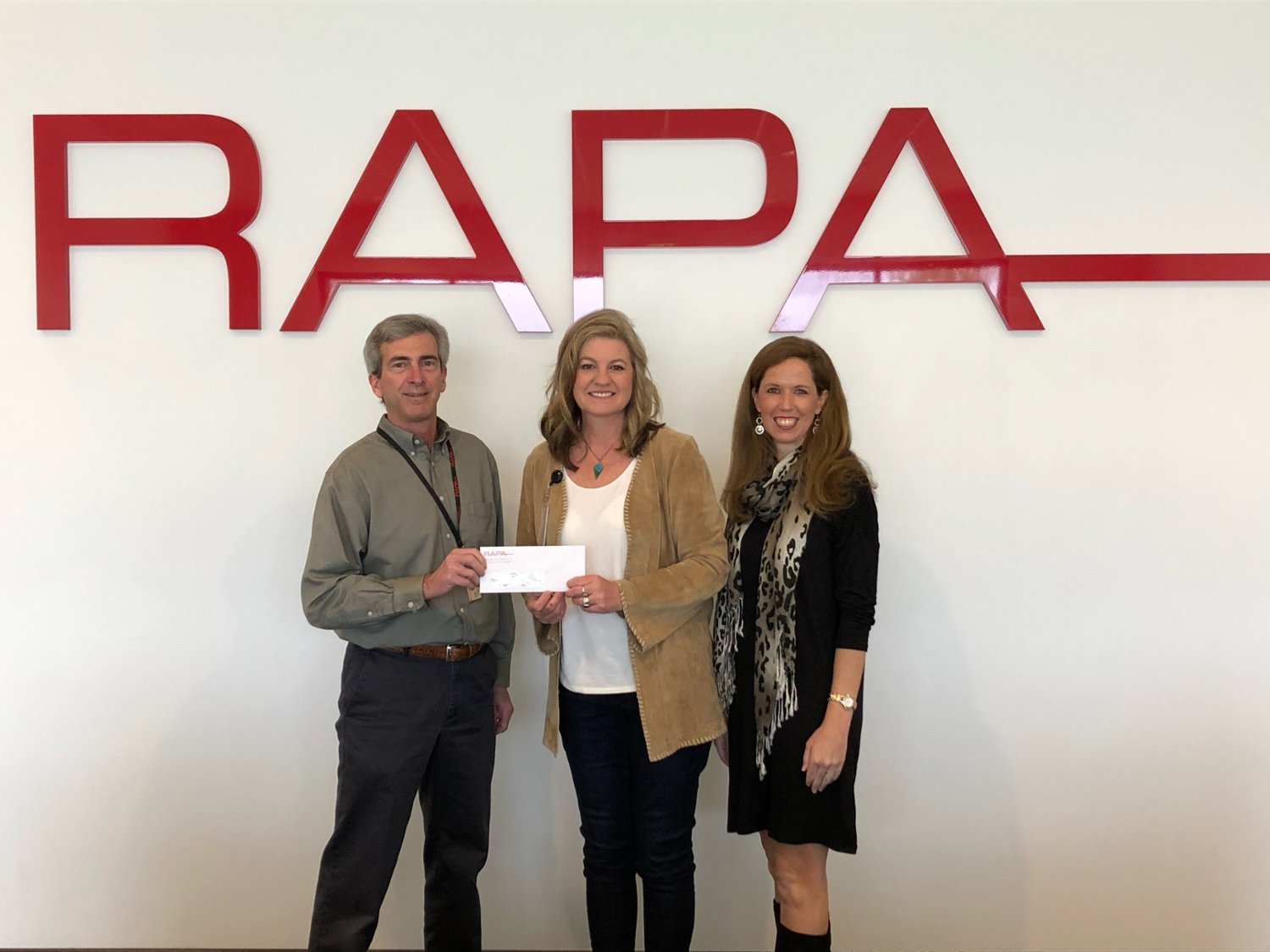  Tim Beasley, human resources manager at RAPA; Mary Lou Ewald, director of outreach at COSAM; and Ashley Underwood, development associate at COSAM. 