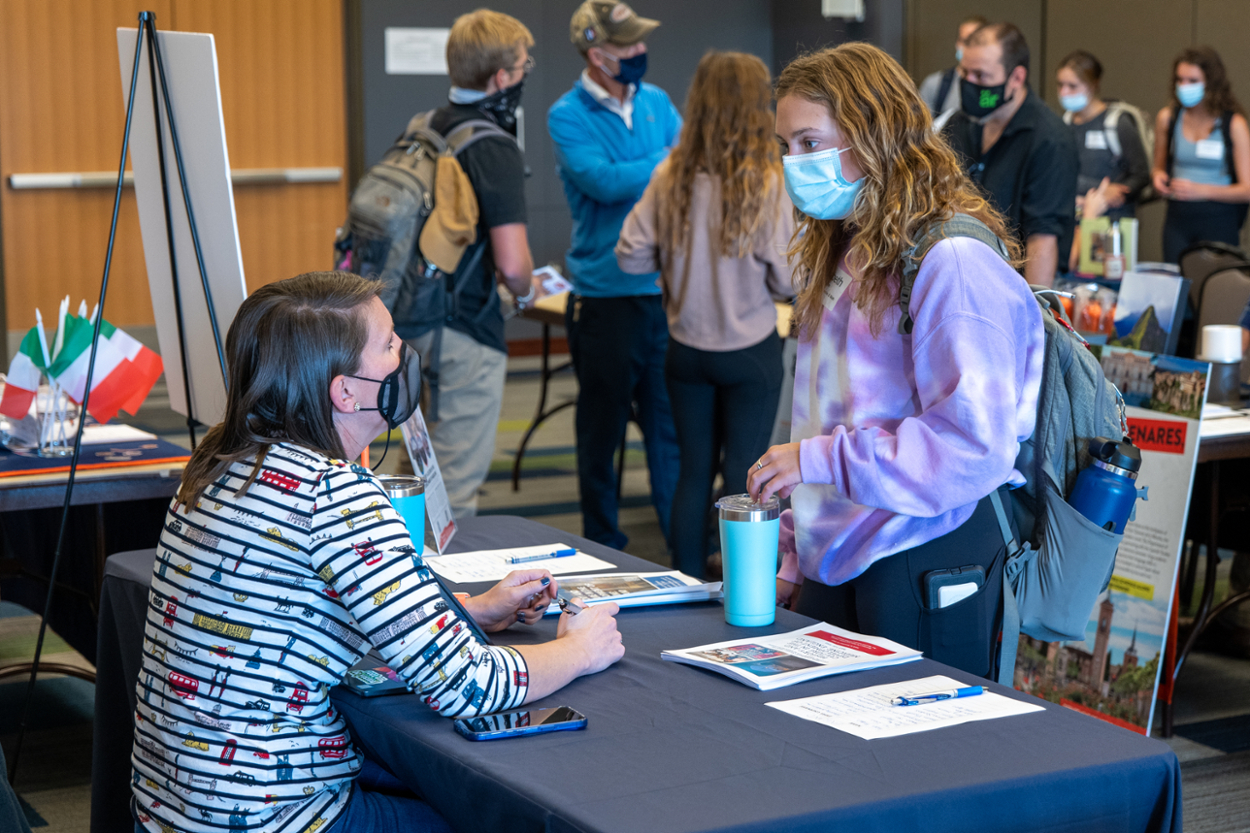 Meredith Powell speaks to a student during the 2021 Study Abroad Fair.  