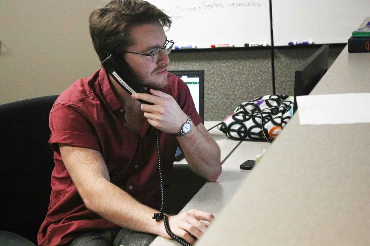 Student answering a call at the IT Service Desk