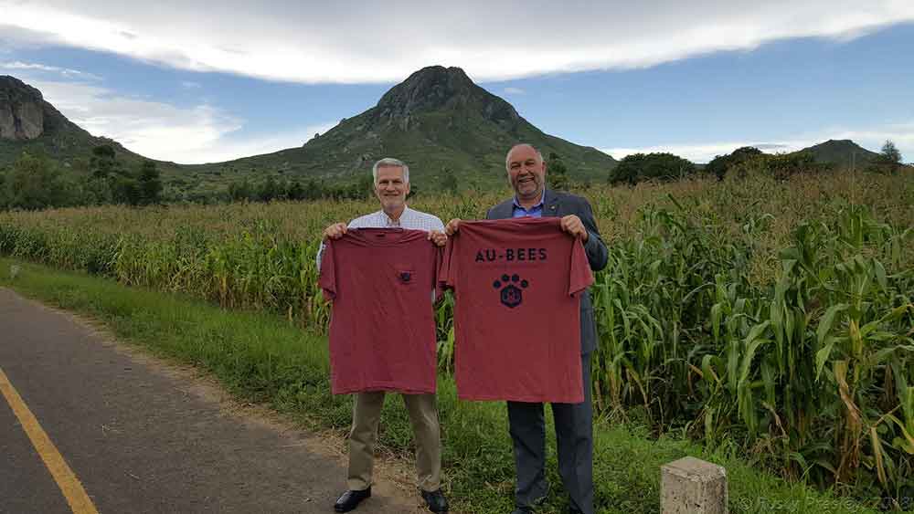 John Helms and President Leath standing by a road in Malawi.