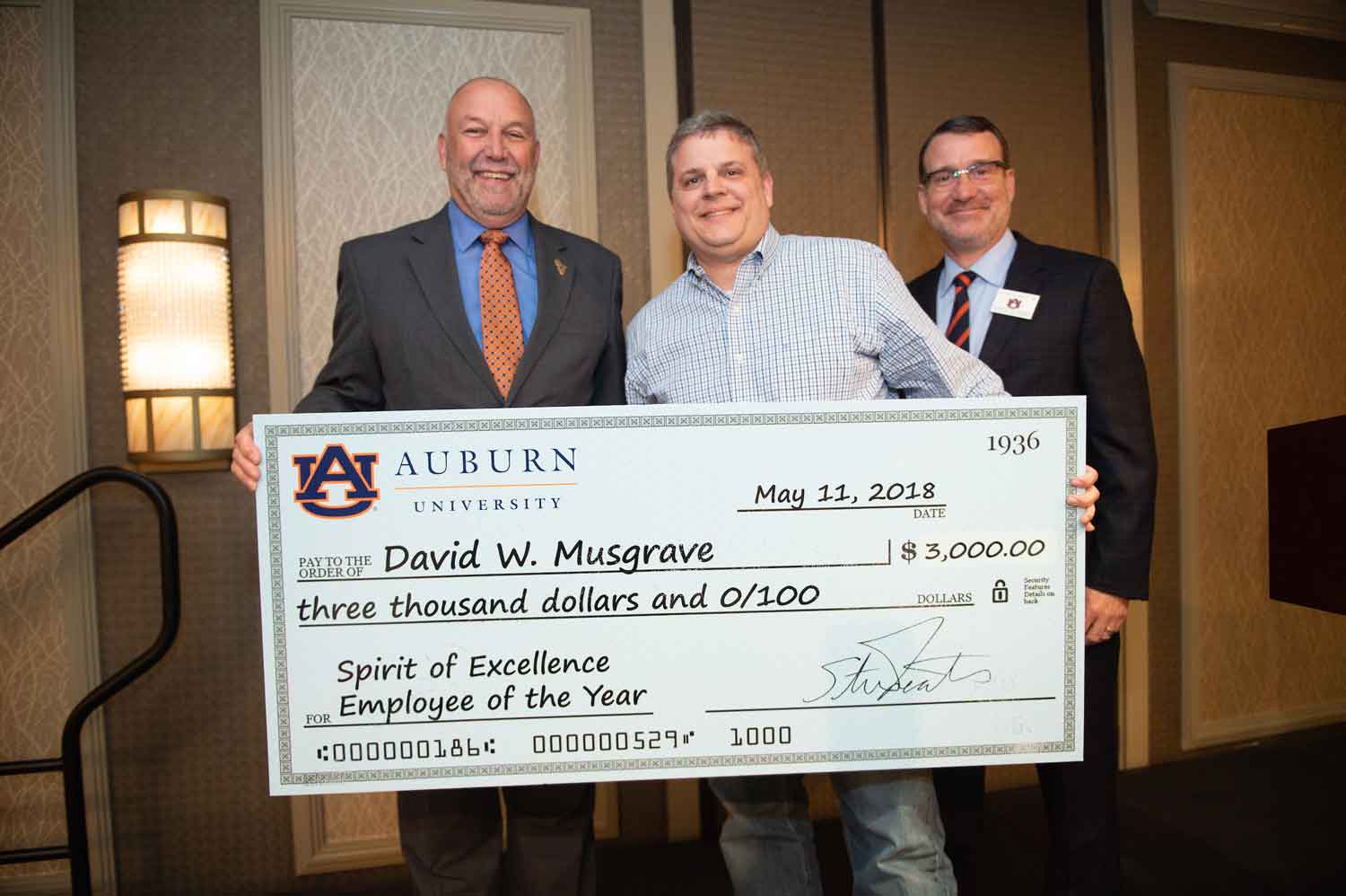 David Musgrave receiving his employee of the year check.
