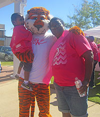 Kristeen Knight posing with her son and Aubie