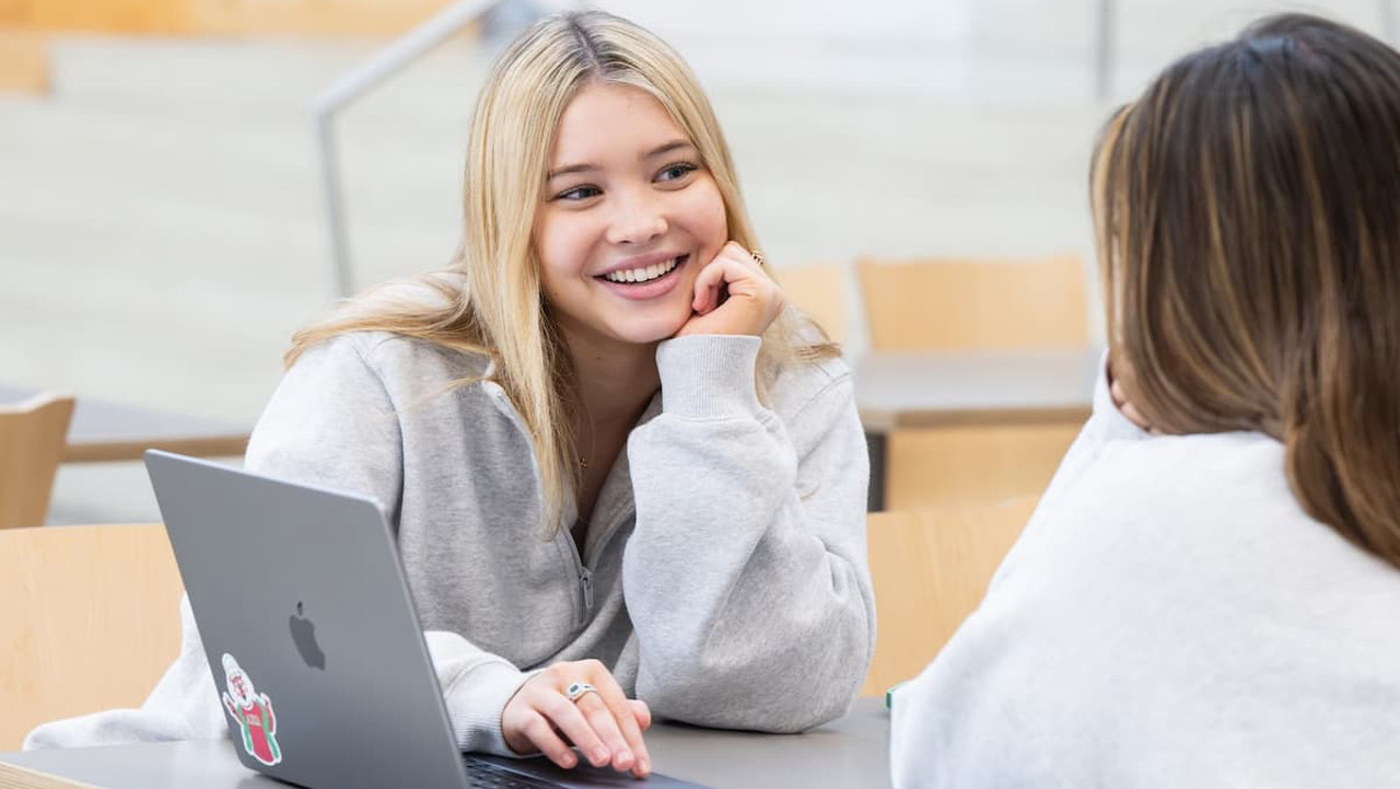 students sitting together at a computer