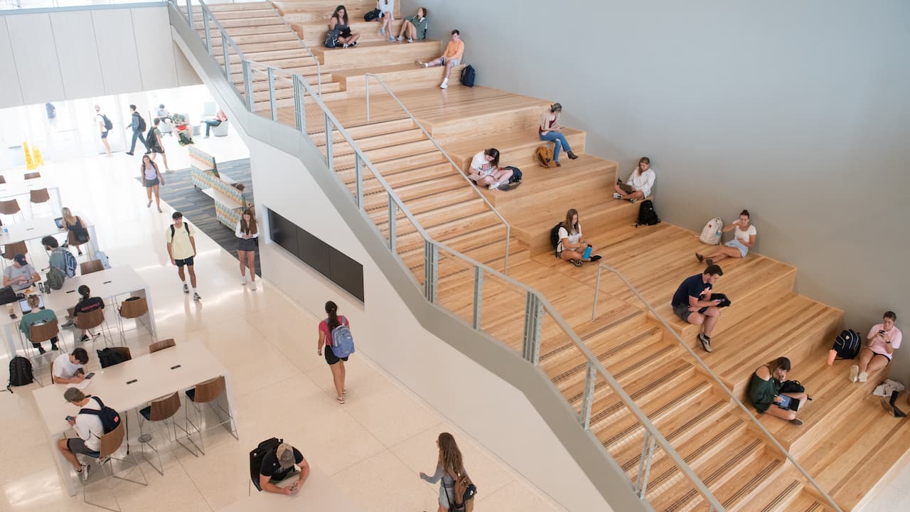 students on stairs in building