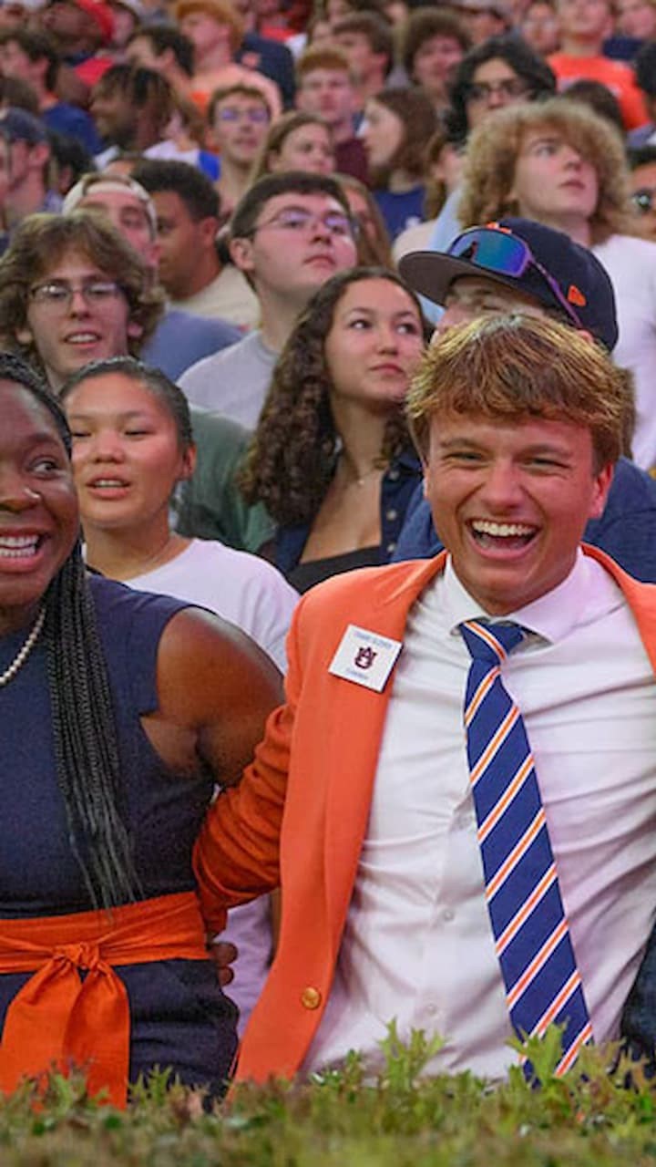 students with their arms linked