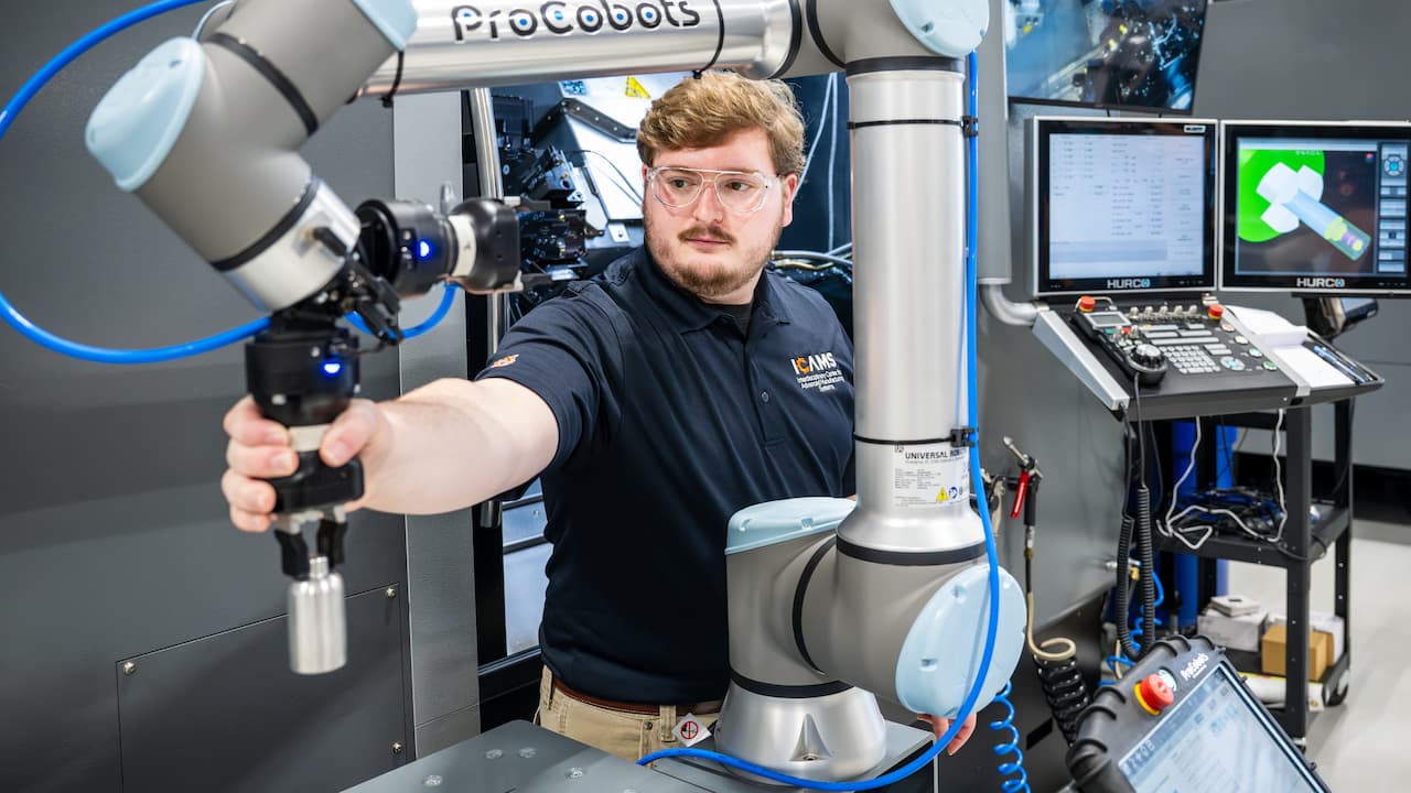 Student working in lab with machinery
