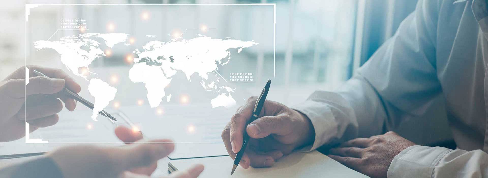 World map graphic displayed over a discussion between two people, representing international programs, collaboration, and global engagement