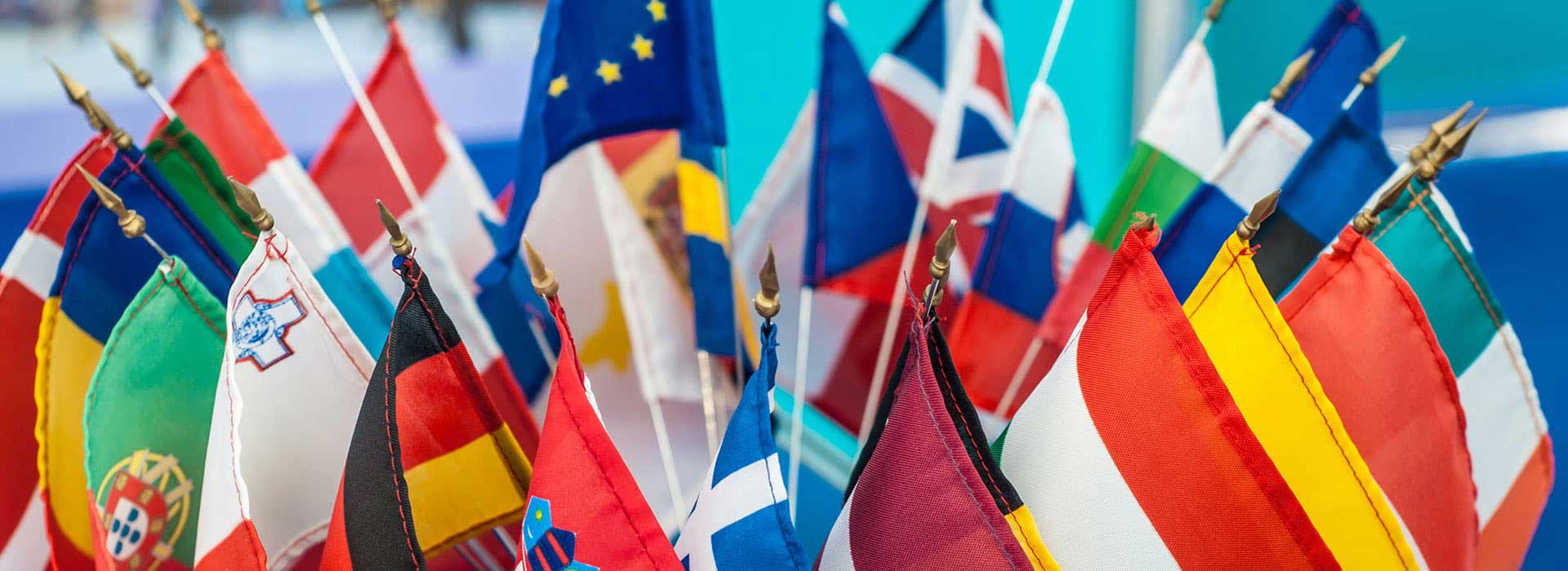 Flags from multiple countries displayed together, symbolizing international education and global learning opportunities