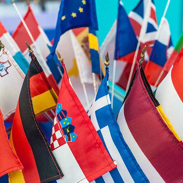 Flags from multiple countries displayed together, symbolizing international programs and global engagement