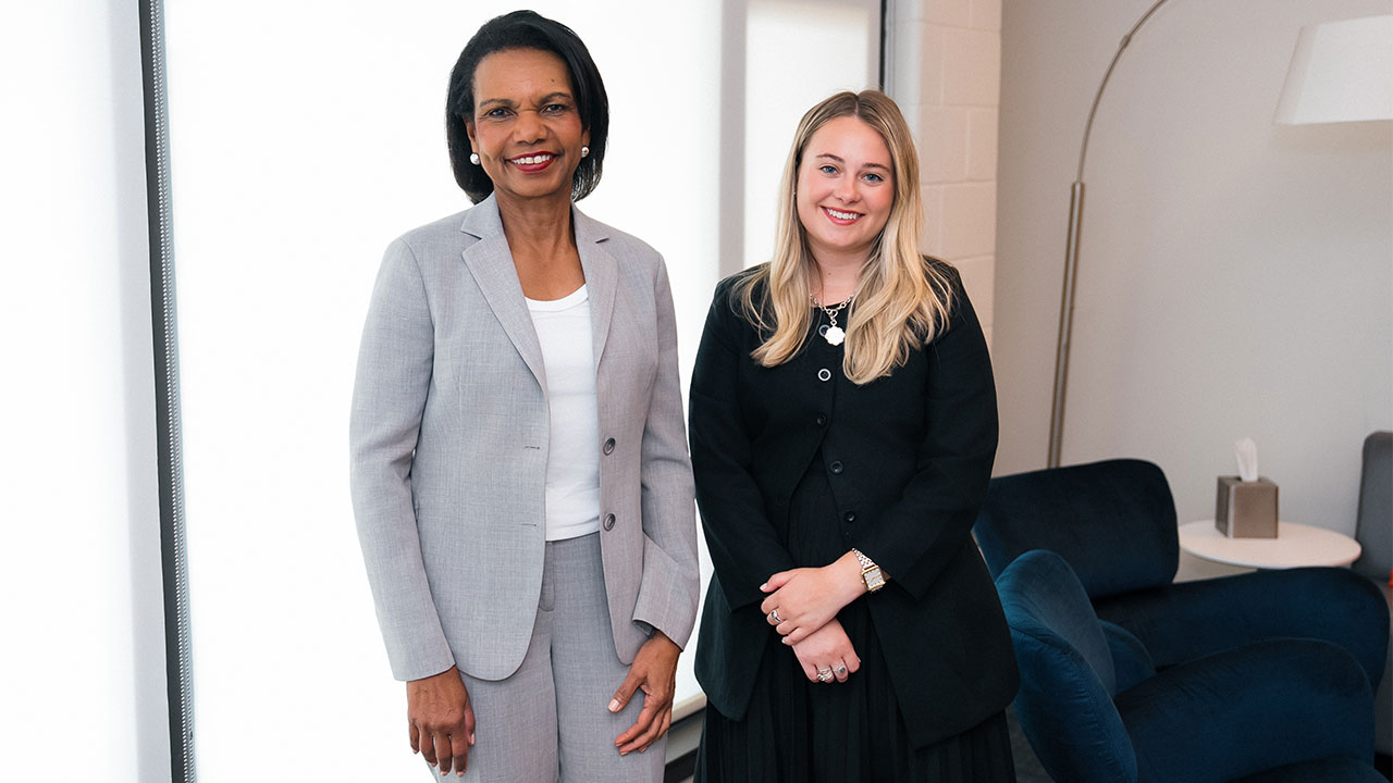 Photo of 66th Secretary Condoleezza Rice and student Buckley Nettles