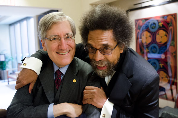 Photo of Robert George and Cornel West hugging