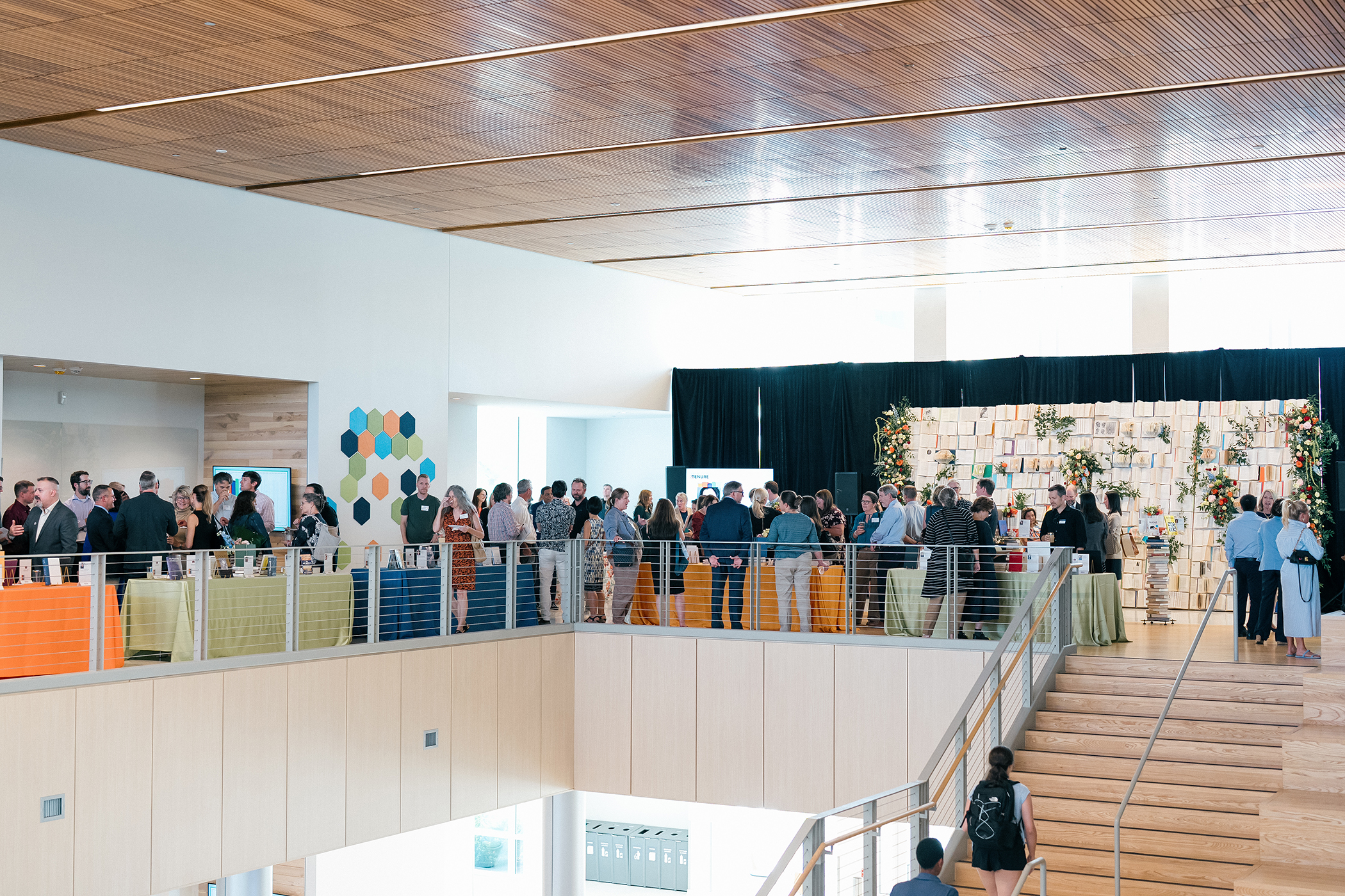 Promotion and Tenure 2025 attendees at book wall