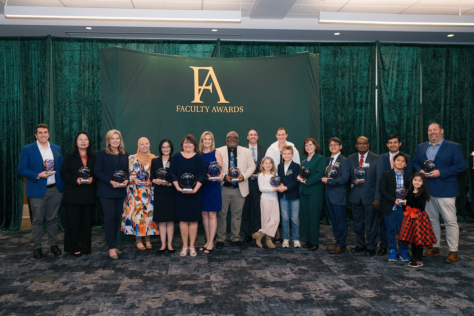 Faculty Awards 2025 winners standing for picture