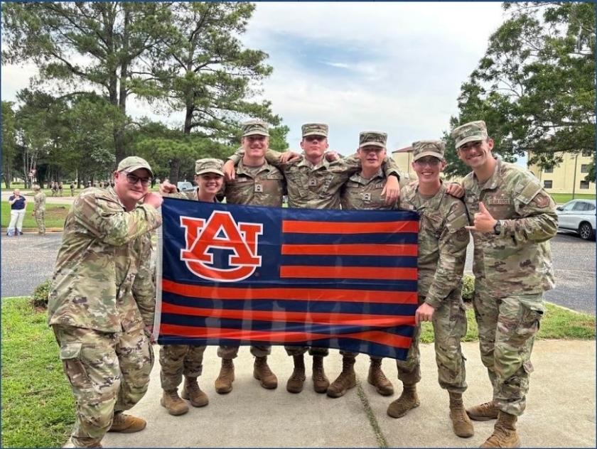 Group of cadets holding Det 005 flag