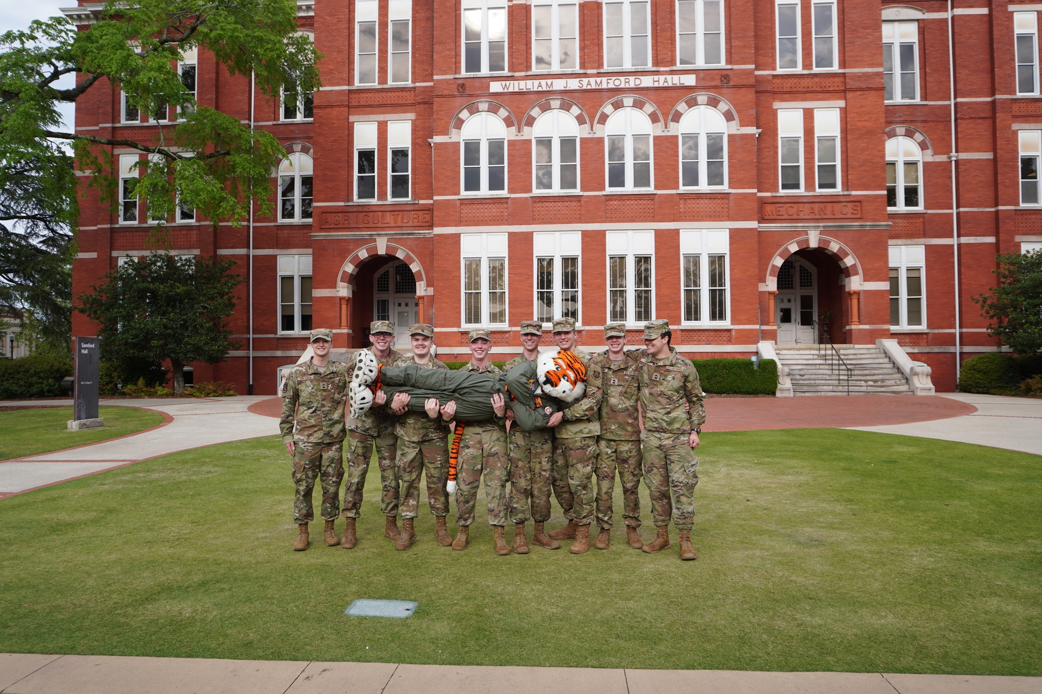 Cadets holding Aubie.