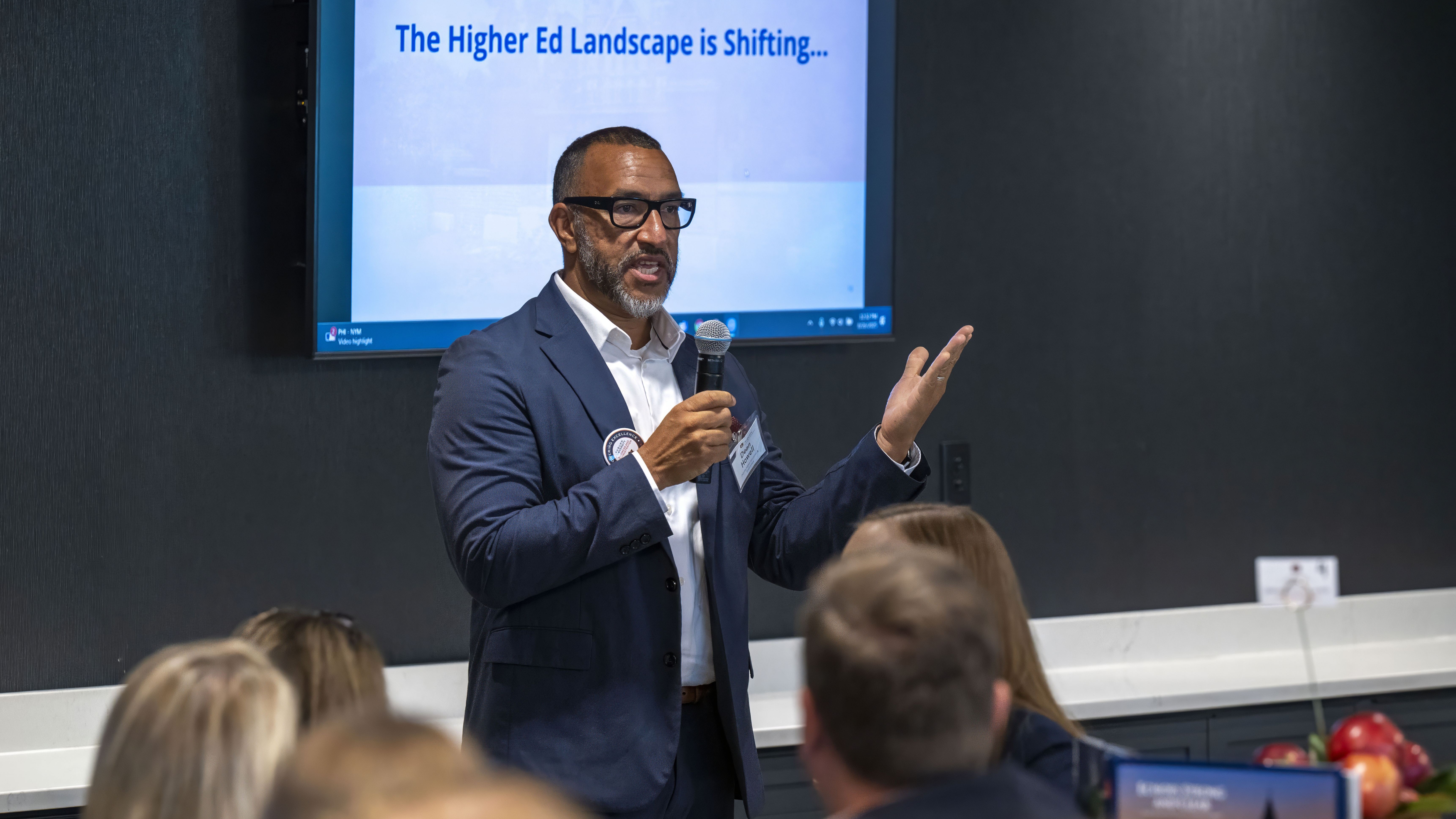 presenter speaking to a room of employees