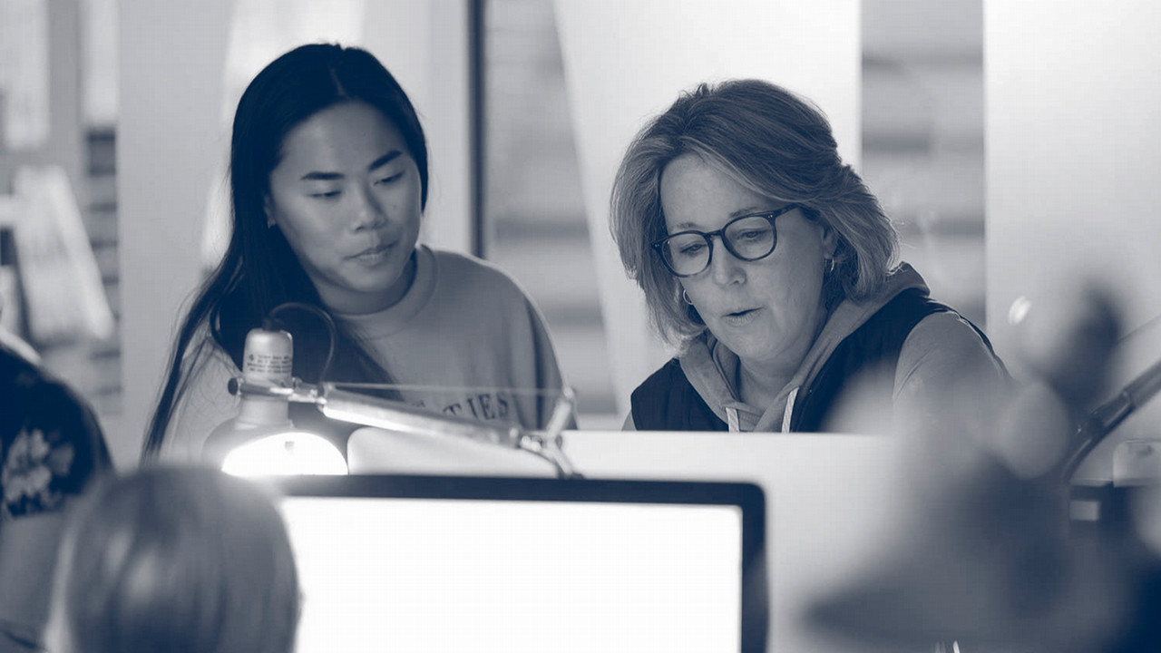 student and teacher working together