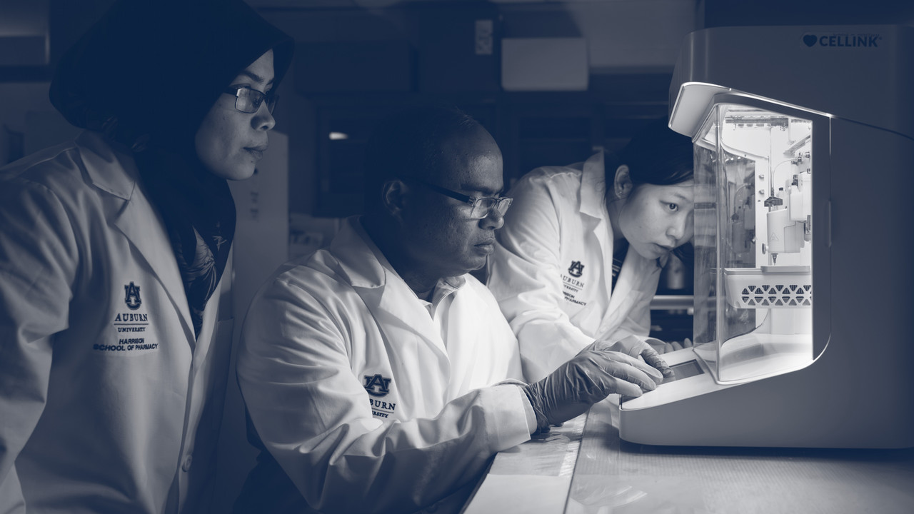 three researchers in a lab