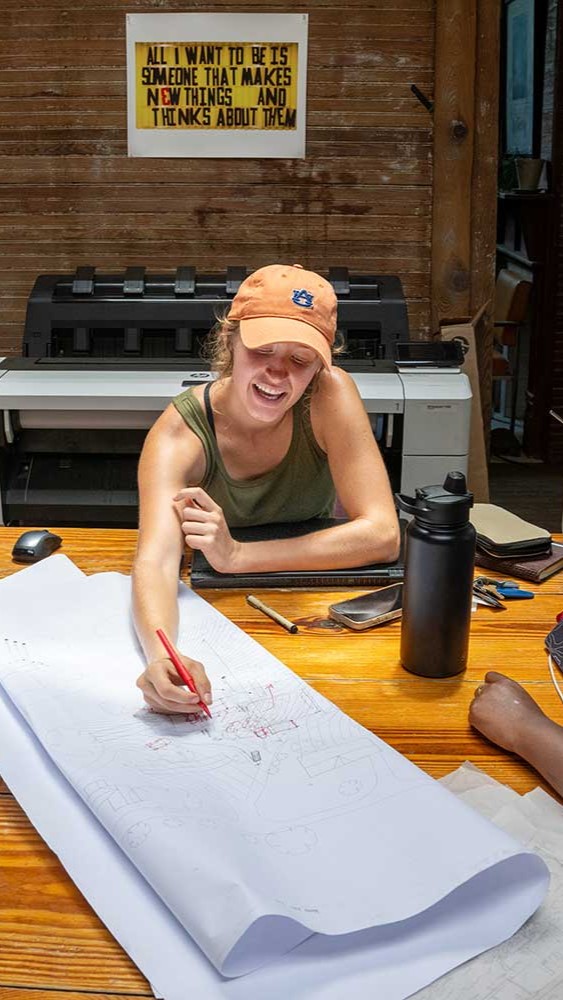 students working on a blueprint together