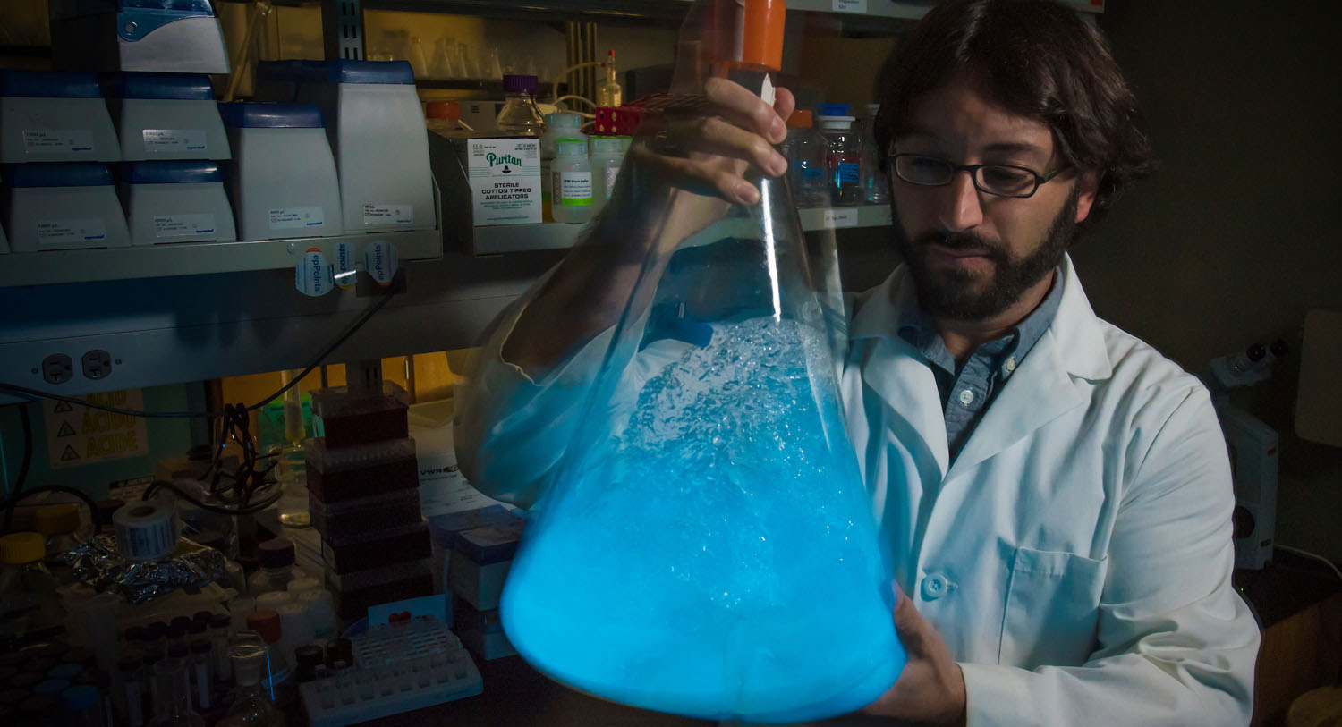 Steven Mansoorabadi with glowing dinoflagellates