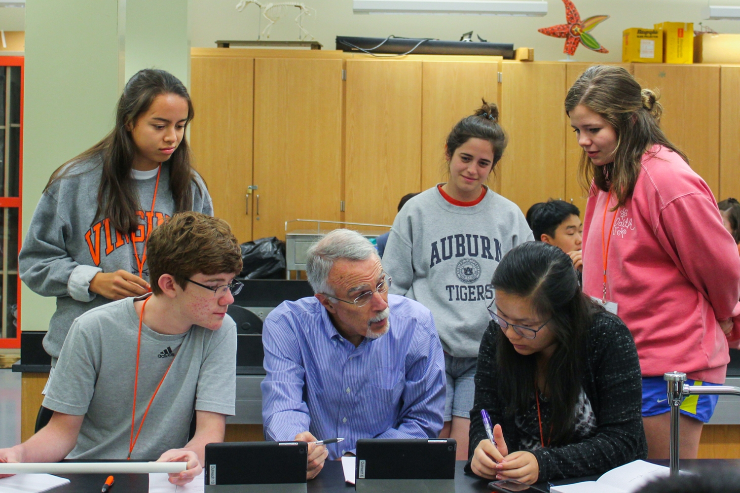 Dean Giordano working with students to construct flutes