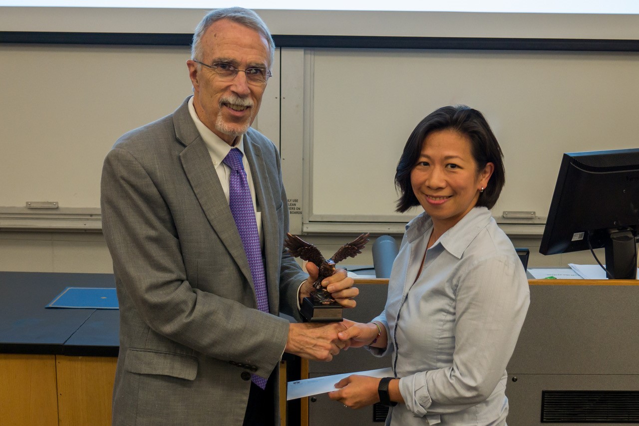 Dean Giordano presenting Joyce with the Lilly-Lovelace Distinguished Service Award in 2019.