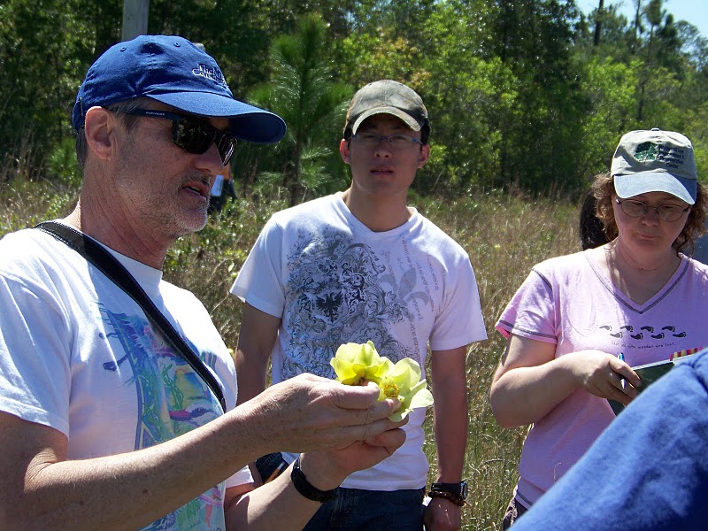 Boyd explaining plants during an outdoor class. 