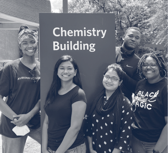 Aishah, far left, with students in front of the chemistry building.