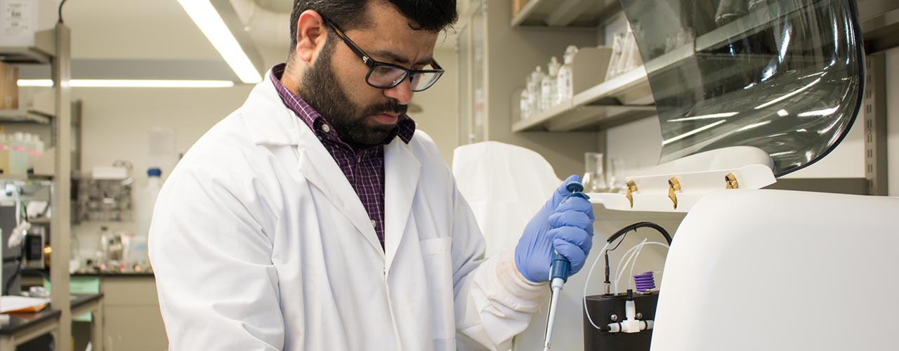 A man works in a science lab.