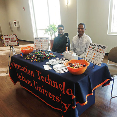 OIT employees at a table event to promote National Cybersecurity Awareness Month