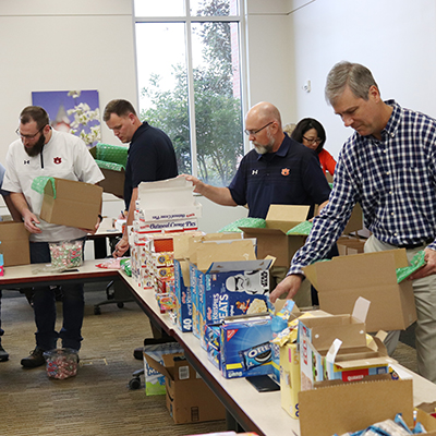 OIT staff members filling boxes to donate to US Troops