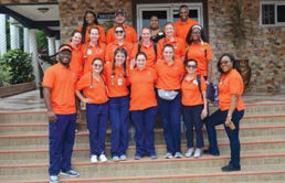 Group of AU Nursing students standing in front of building in Ghana
