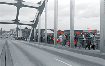 Crowd of people walking across Selma bridge