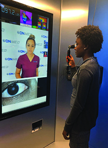 Woman standing in front of screen for telemedicine help