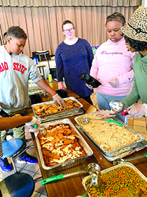 Whitney Lee, Outreach programs administrator, recently connected with students in Young Professionals in Training, or YPiT, to discuss food insecurity in the community. As an added bonus they packaged 40 meals for a women’s and children’s shelter in Opelika, Alabama. The food was provided by The Campus Kitchen at Auburn University.
