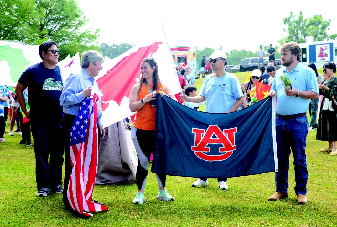 Global Community Day members with Auburn flag