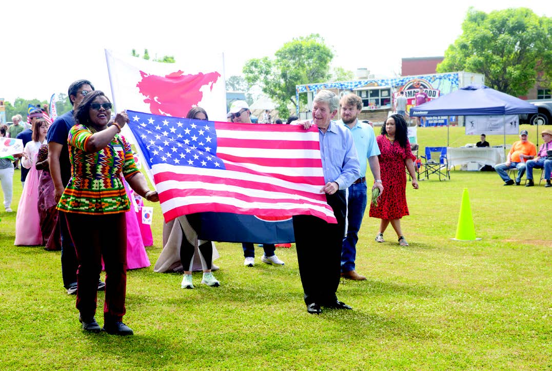 Global Community Day members with American flag