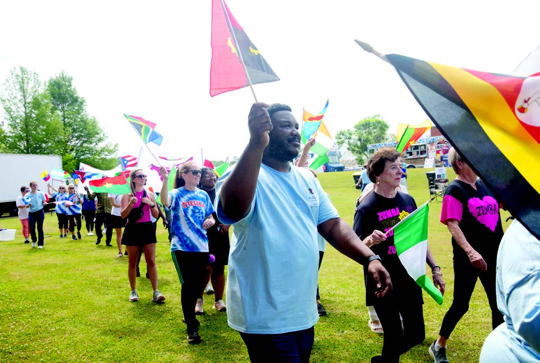 Global Community Day members waving flags