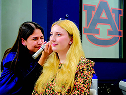 Rural Health Fellow Lexy Barraza conducts a hearing screening for classmate Abigail Weyerman.