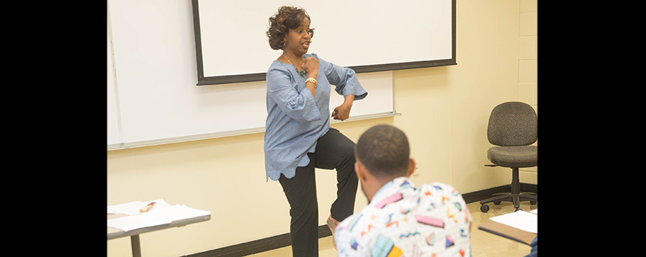 A. Faye Calhoun teaching dramatic interpretation