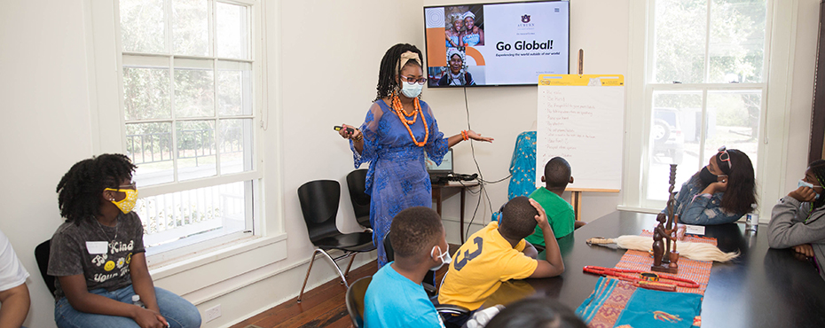 Mac-Jane Crayton giving presentation on Nigeria for attendees of “Global Days” at Learning Spaces Saturday School