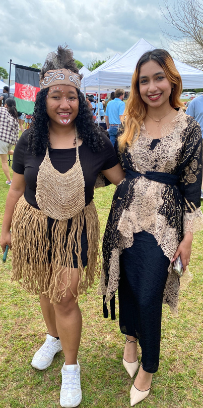 Two female participants at the event wearing cultural attire