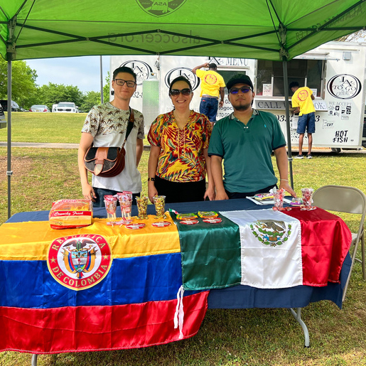 Volunteers behind theLatinX Cultural Table