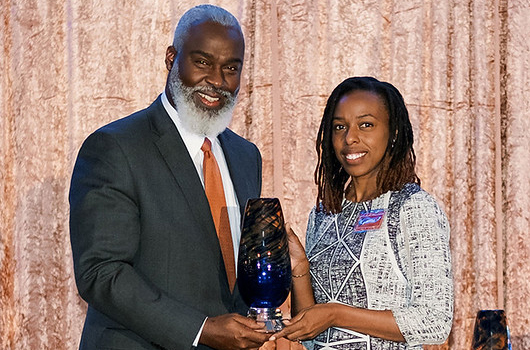 Adrienne Duke-Marks, Associate Professor and Extension Faculty, Department of Human Development and Family Science, College of Human Sciences receives the 2023 Award for Excellence in Faculty Outreach from Royrickers Cook, Vice President for University Outreach.