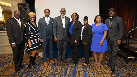 NFBPA officers, Dr. Cook, Alfred Davis, Bishop Nolan Torbert, and others pose together. 