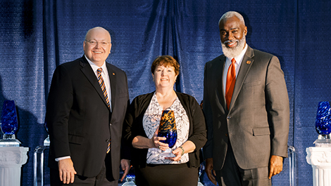 Dr. Roberts, Sefton (with her award) and Dr. Cook