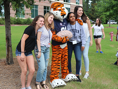 Four high school students with Aubie