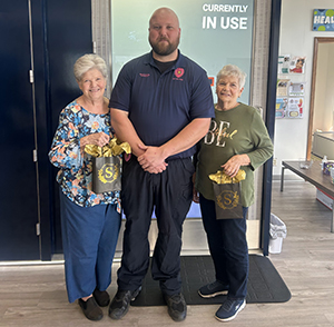 Women who attended the Chambers County Women's Wellness Event posing with a police officer.